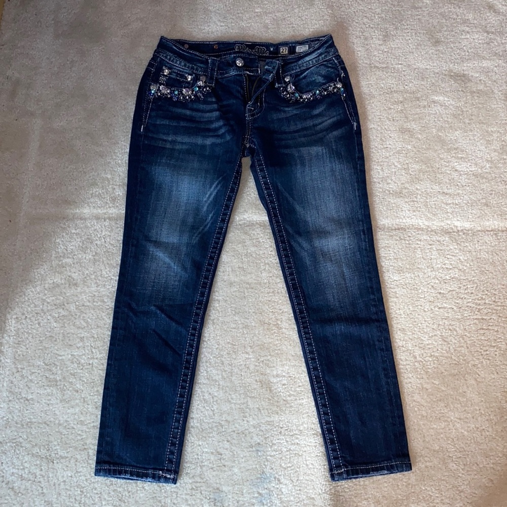 Miss Me signature crop skinny jeans. Blue and purple bedazzled front pockets.